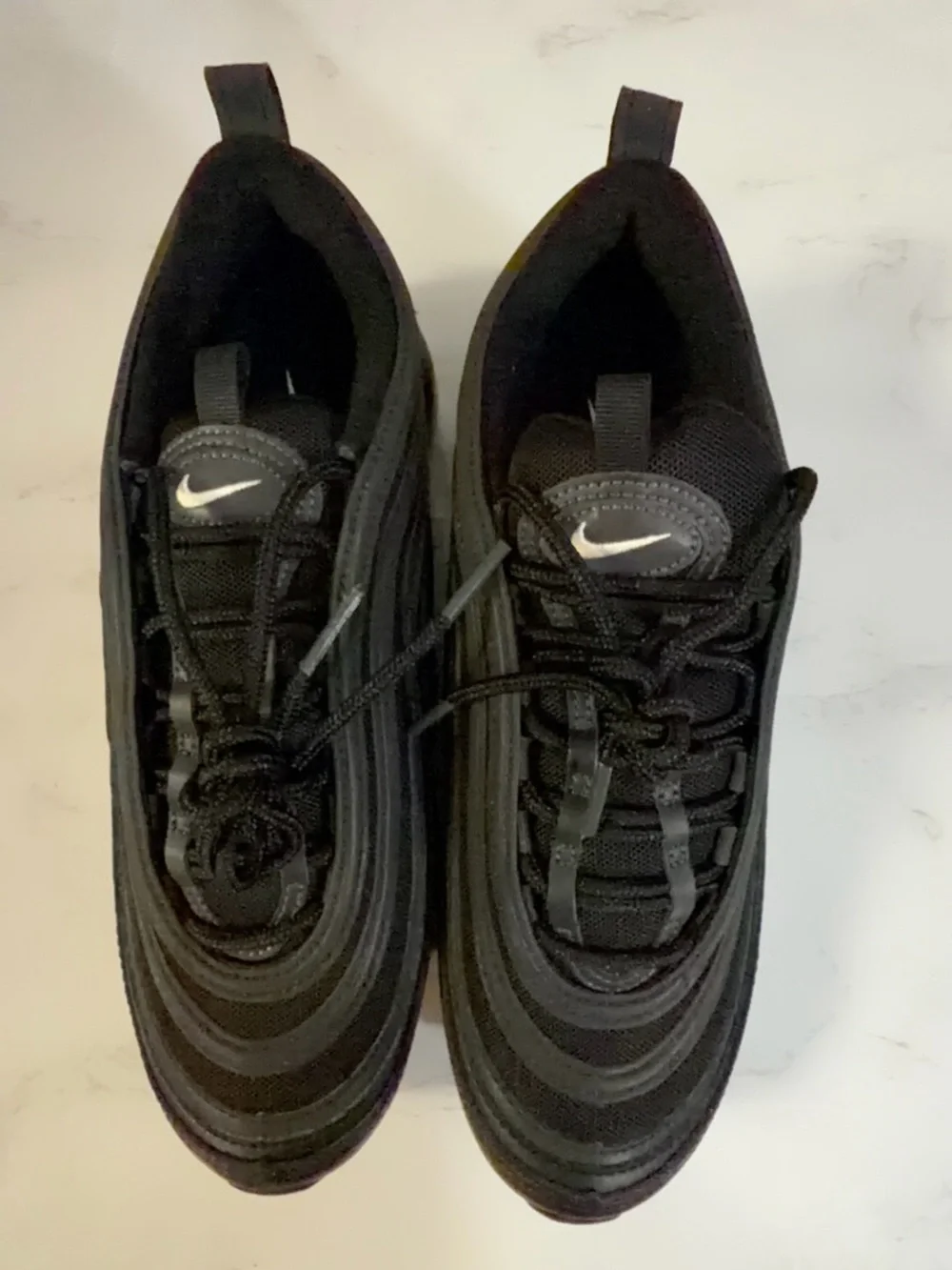 Nike Men’s Black Sneakers with White Swoosh